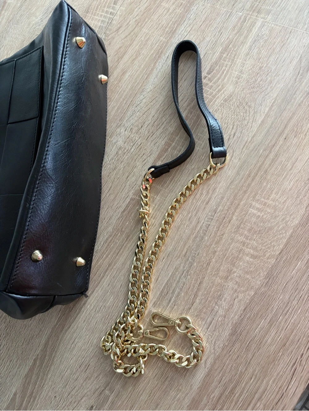Structured Black Leather Top-Handle Satchel with Woven Flap Detail